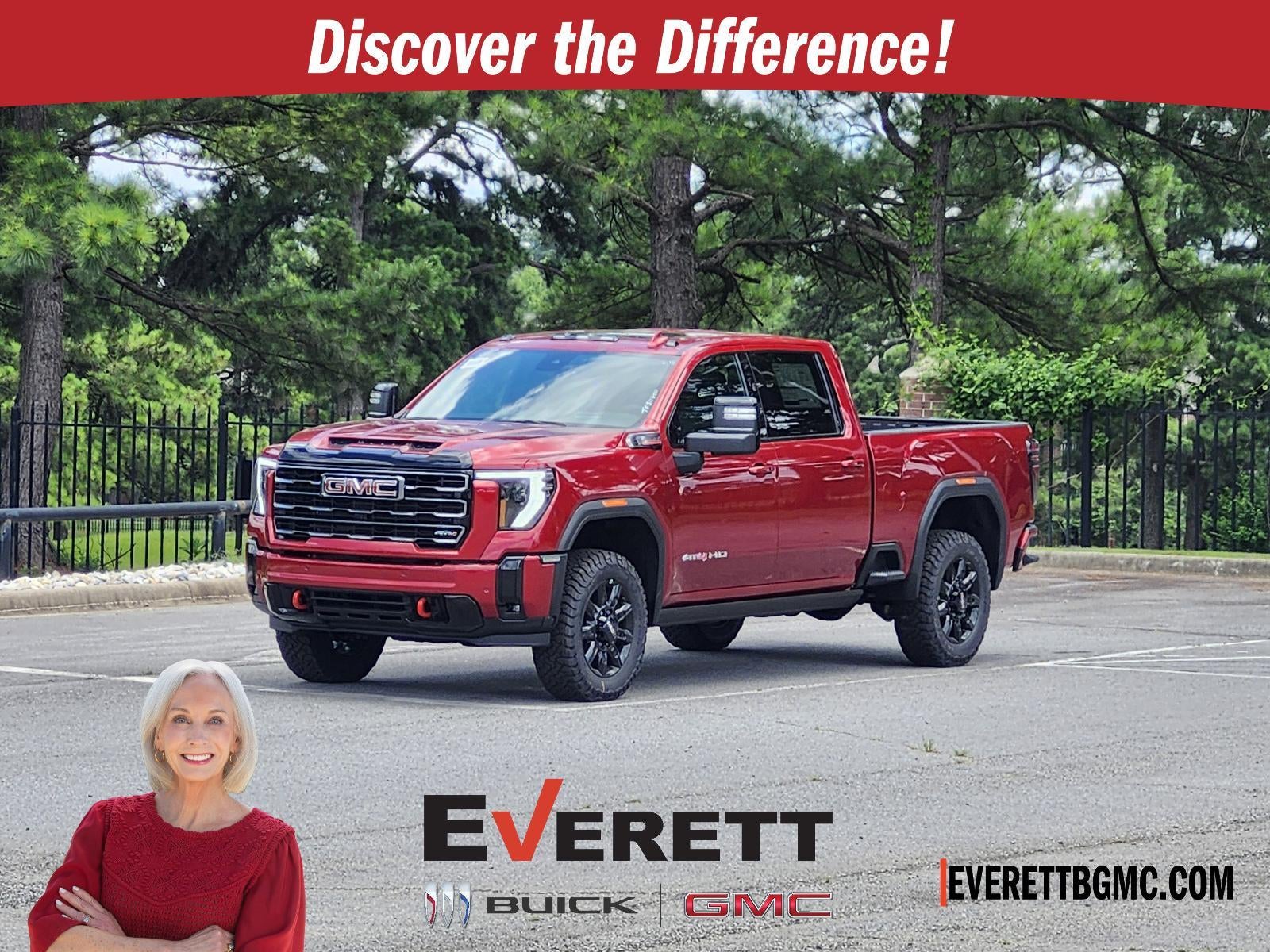 2026 GMC Sierra 2500 HD Crew Cab Standard Box 4-Wheel Drive AT4 in Volcanic Red Tintcoat — front three-quarter view