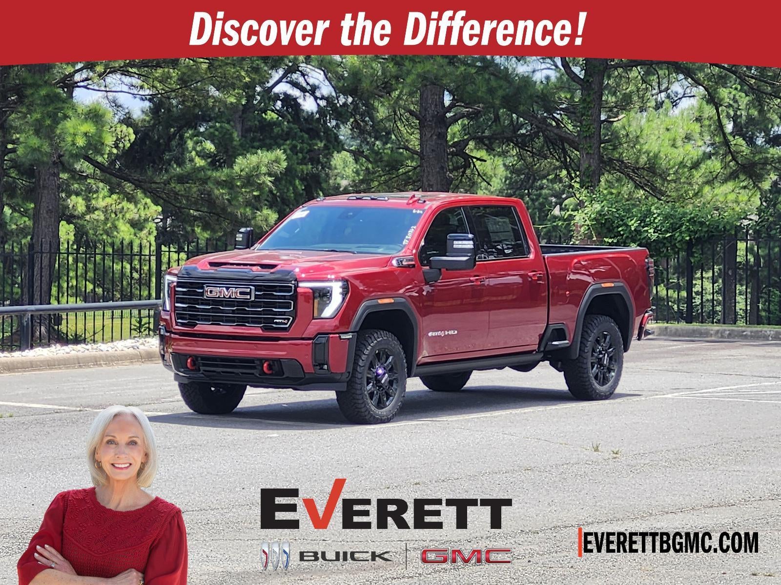 2026 GMC Sierra 2500 HD Crew Cab Standard Box 4-Wheel Drive AT4 in Volcanic Red Tintcoat — front three-quarter view