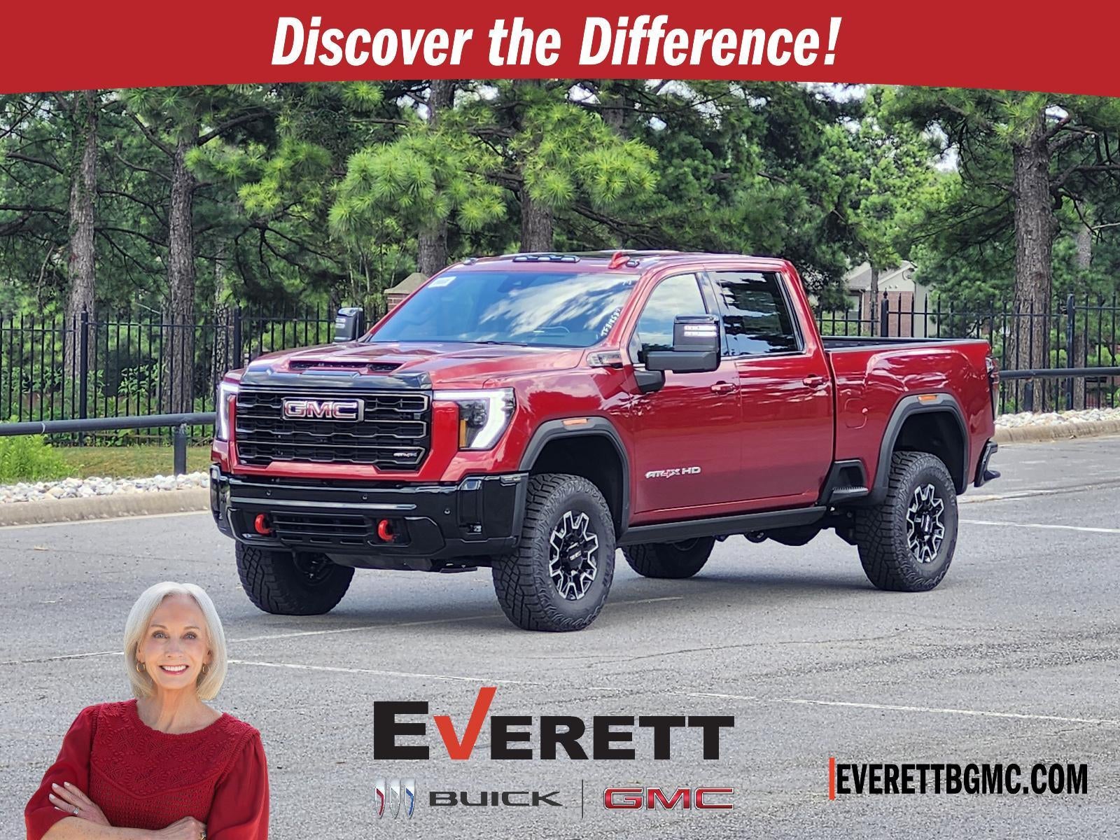 2026 GMC Sierra 2500 HD Crew Cab Standard Box 4-Wheel Drive AT4X in Volcanic Red Tintcoat — front three-quarter view
